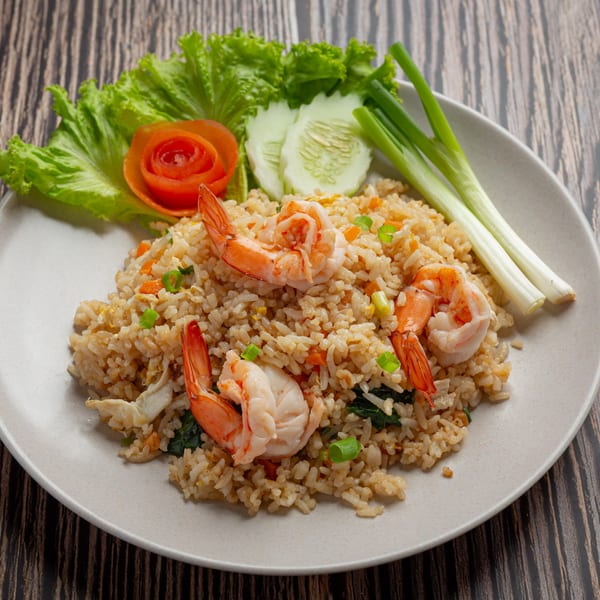 Spoon Thai Kitchen's shrimp fried rice with lettuce, cucumber, tomato, and green onions.